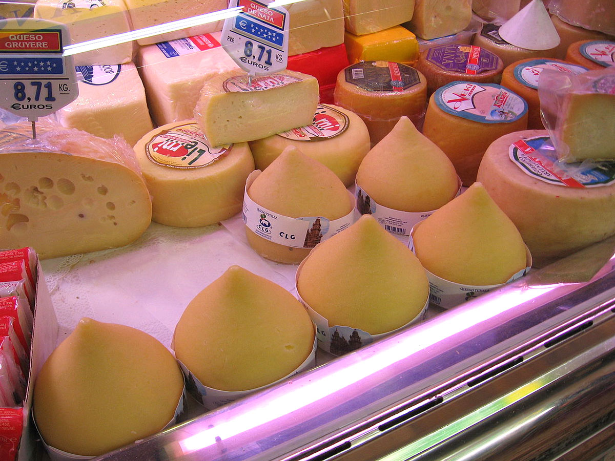 Tetilla cheeses in the shop's display cabinet