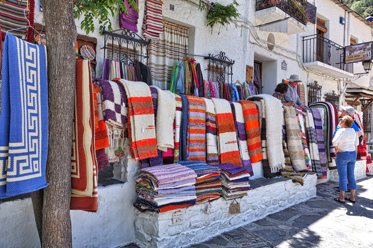 Pampaneira’s shops selling colourful hand woven rugs