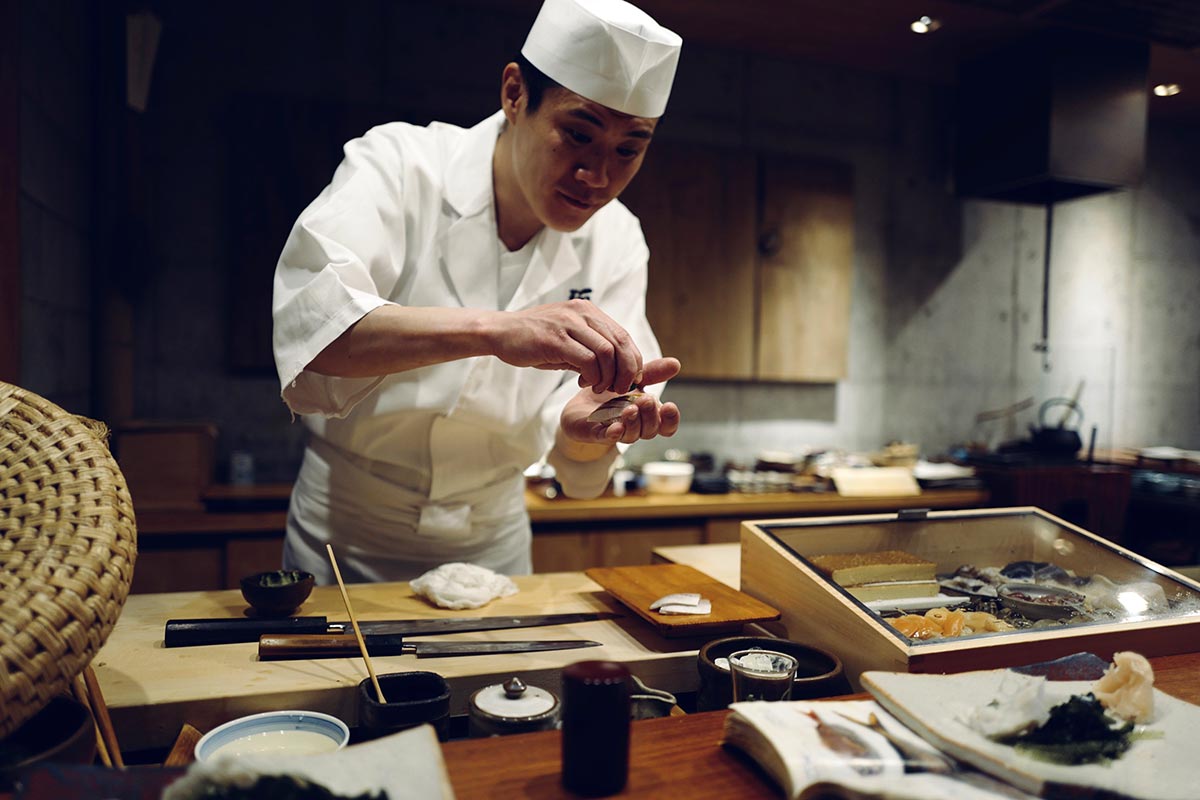 Sushi chef and kitchen