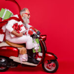 Father Chritmas on a moped with presents