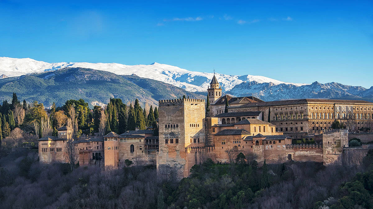 Alhambra Palace in Granada with snow on the Sierra Nevada