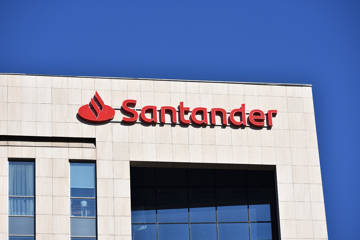 red Santander sign on a building