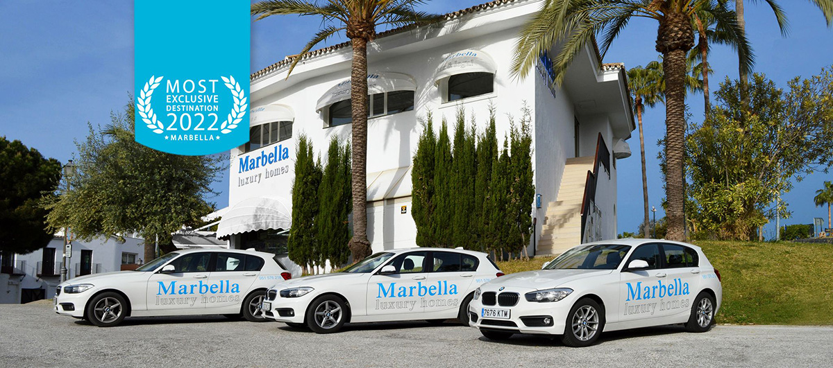 Marbella Luxury Homes office and three branded cars