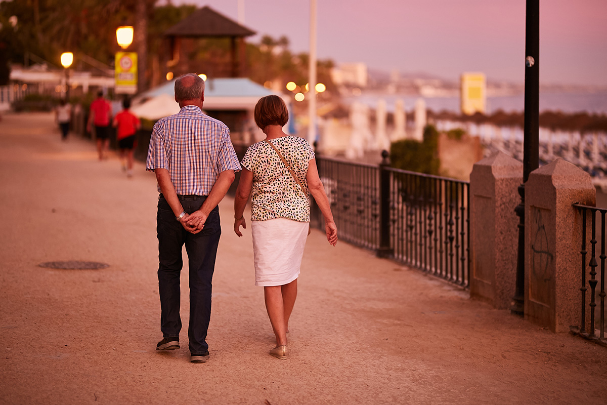 Strolling along the promenade at sunset is a favourite pastime in Marbella