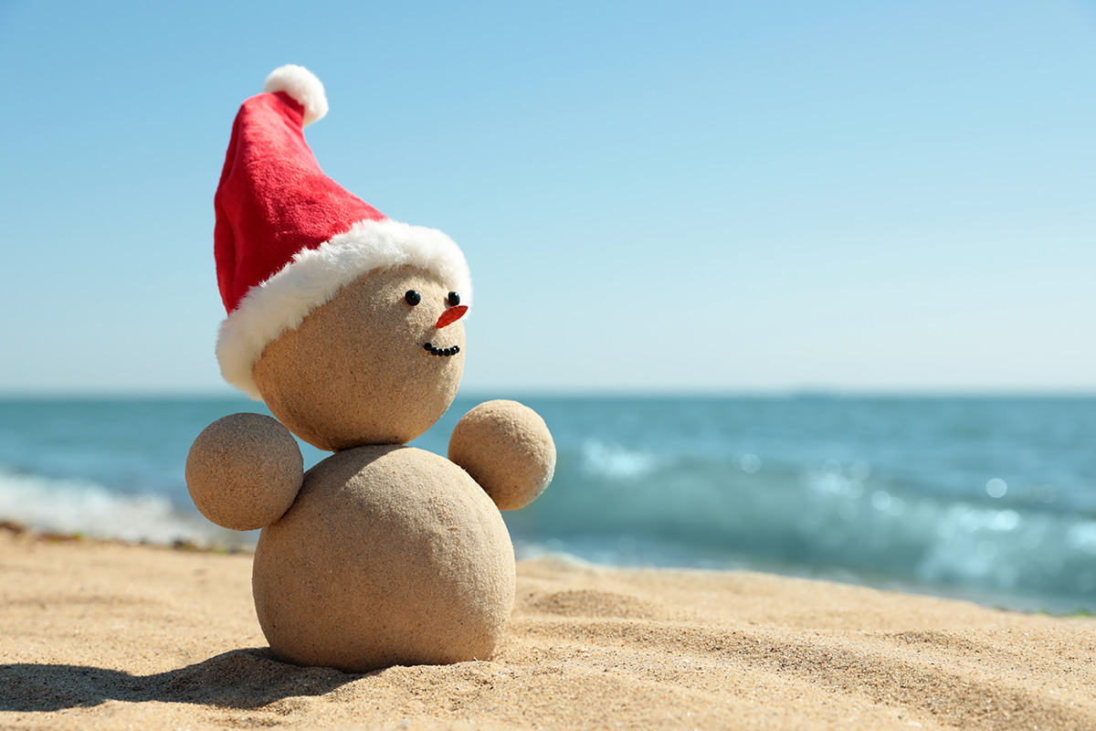 Sandman in the image of a snowman on the beach.